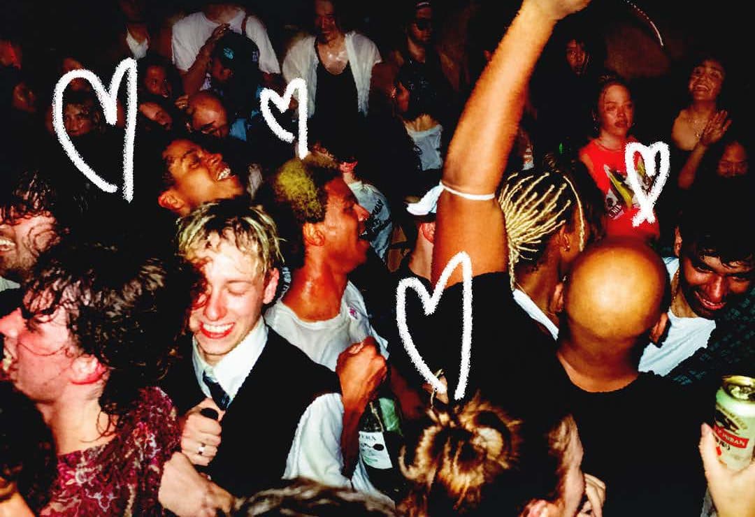 Crowd with hand-drawn hearts